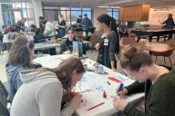 People working on art projects at the Creative Jam