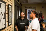 People looking at art at Aims student art show