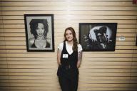 Aims Student Art Show artist with two of her pieces
