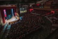 Aims Miller Auditorium with a full audience