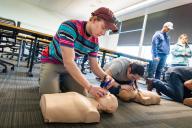 CPR class students with manquins.