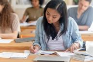 Media Writing student working on paper
