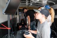 Kids using simulators in the mobile aviation lab