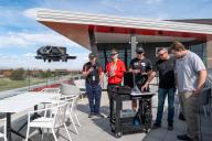 Aims UAS Students with flying drone on Welcome Center Patio