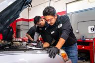 Aims automotive students work on a vehicle