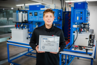Ben Rager holding SACA certificate at the ATTC lab