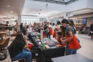Information Tables and people at Discover Aims Events