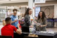 People at a booth at Discover Aims events