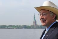 Ken Salazar with Statue of Liberty in the background
