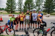 people standing in front of bikes