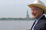 Ken Salazar with Statue of Liberty in the background
