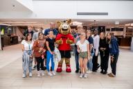 Aims Students posing with Arty the Aardvark mascot at the Student Commons