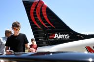 People looking at Aims Airplanes