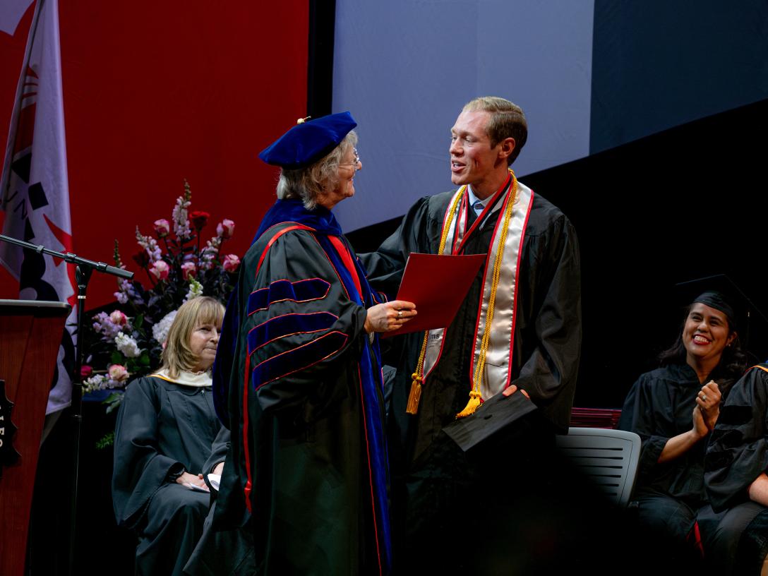 Dr. Leah L. Bornstein and Aiden Rowe at Commencement