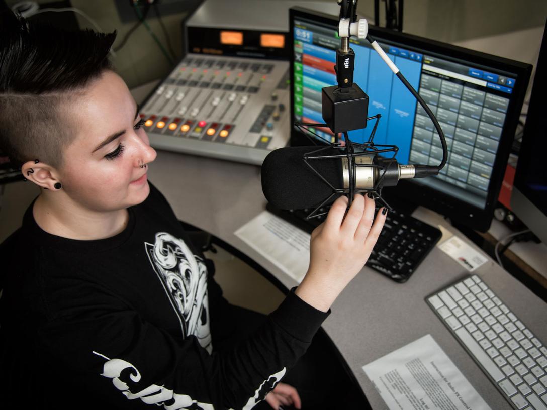 Radio production student in the sound booth