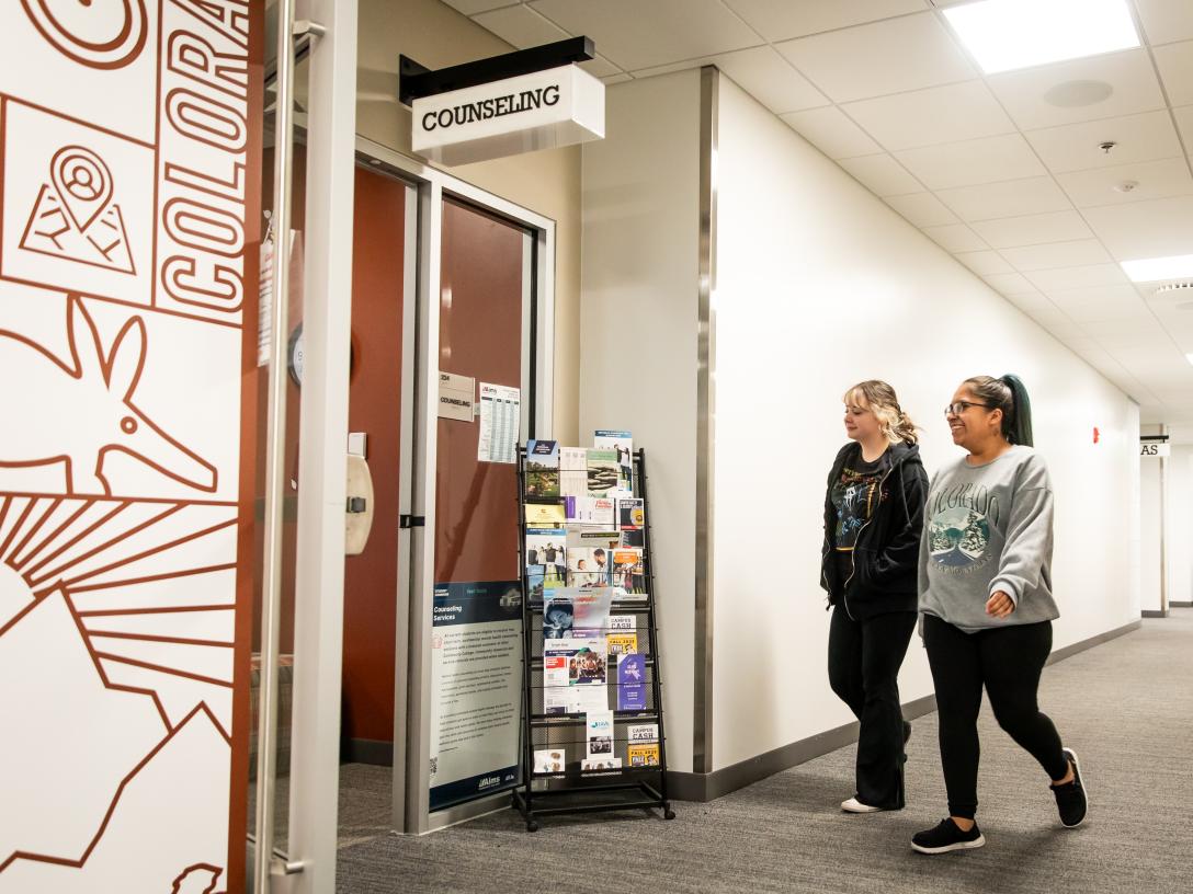 students walking into counciling services at Aims Student Commons