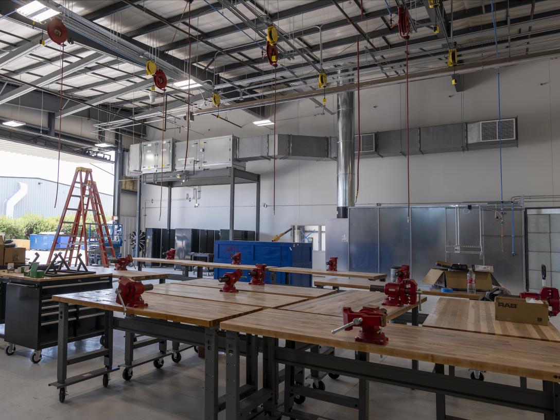 engine shop with work tables and ladders