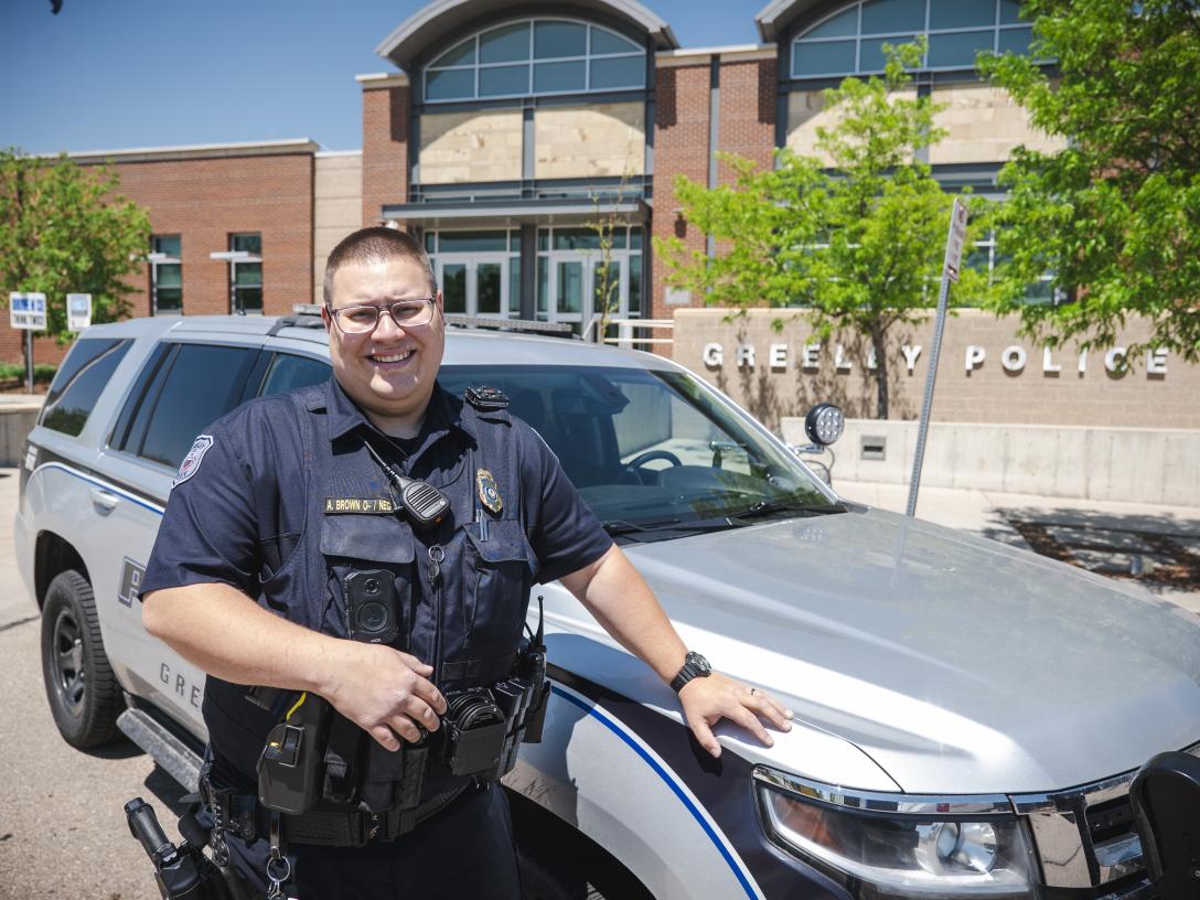Andrew Brown at Greeley Police Department with Police SUV