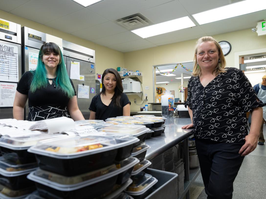Loveland Community Kitchen with packed food and employees