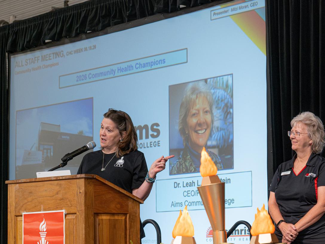Mitzi Moran presenting award to Dr. B