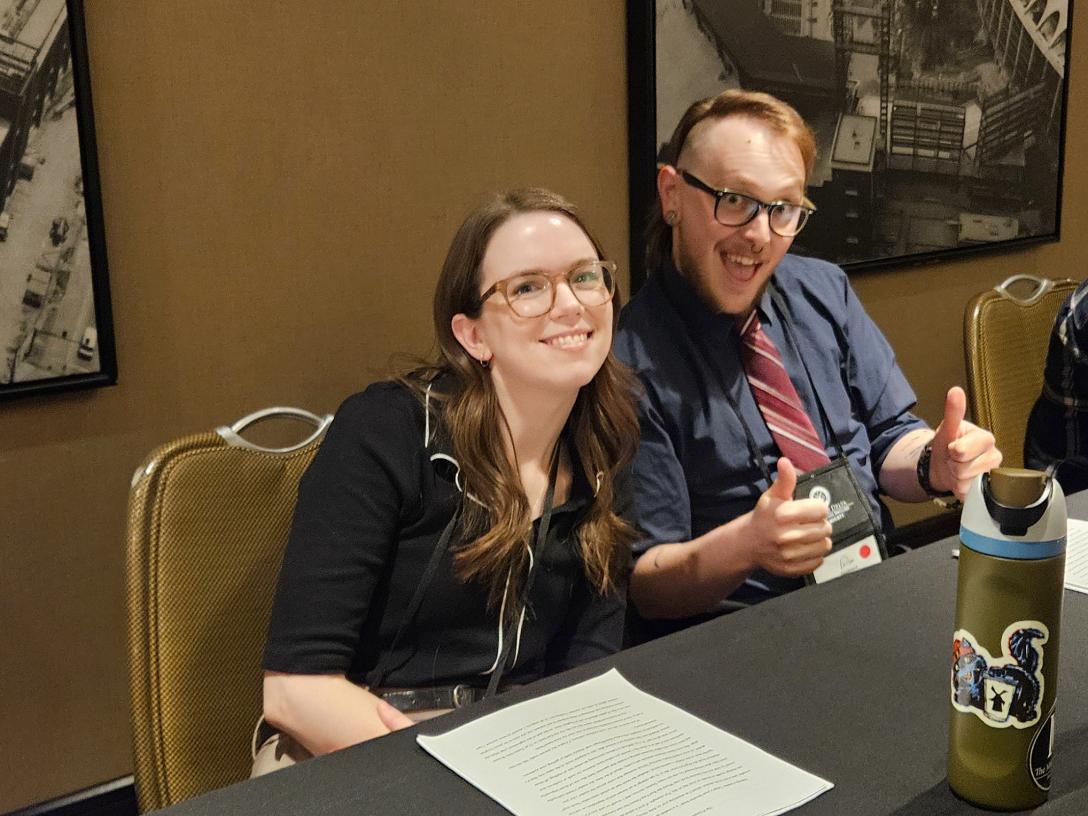 students smiling at conference