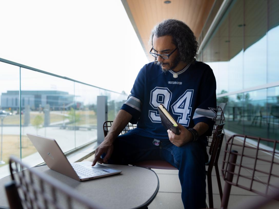 Jeremiah Oatman working on a laptop