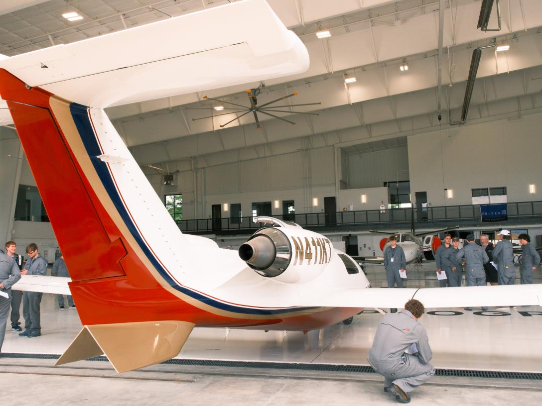  Aircraft Maintenance students inspect the Maverick TwinJet 1500
