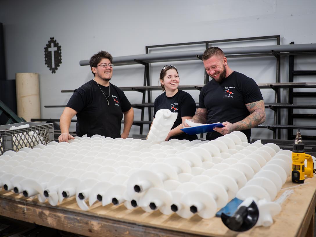 Alex and his team inspecting plastic spirals