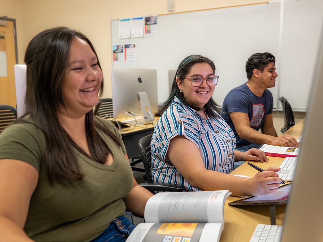Aims Community College students in a classroom with computers
