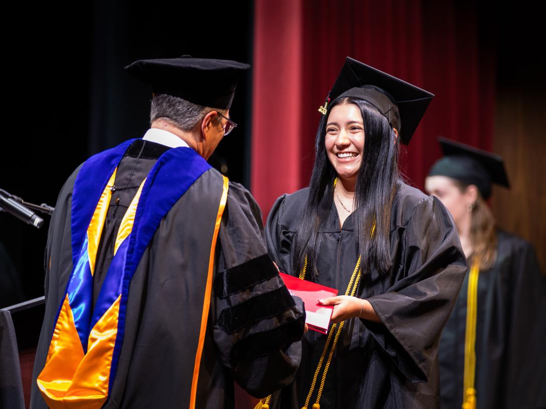 Aims Student getting diploma