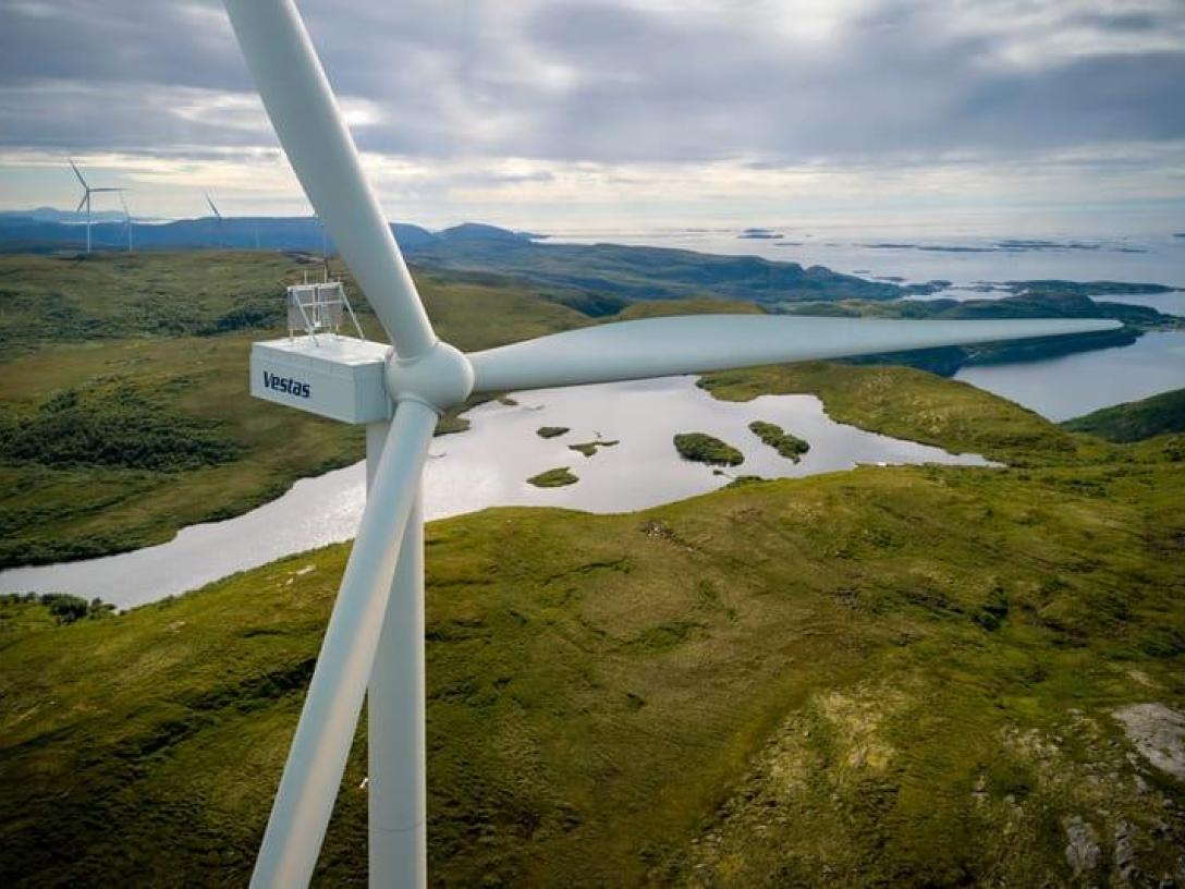 close-up shot of wind turbine overlooking landscape
