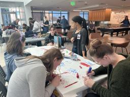 People working on art projects at the Creative Jam