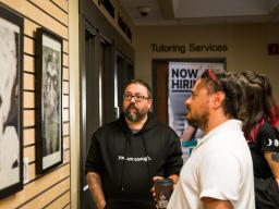 People looking at art at Aims student art show