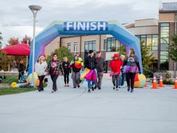 LGBTQ+ fun run partisipants at the finish line