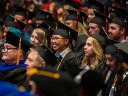 Students in cap and gown regalia for the Spring 2024 Commencement Ceremony at Aims Community College