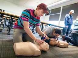 CPR class students with manquins. 