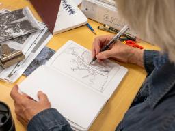 Continuing Education personal enrichment student drawing in a notebook