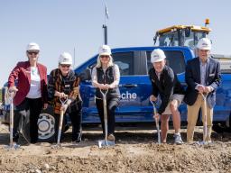 People with shovels at groundbreaking ceremony
