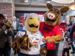 Arty the Aardvark mascot and the Colorado Eagles mascot pose together