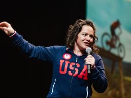 Brittani Coury on stage at the Aims Welcome Center