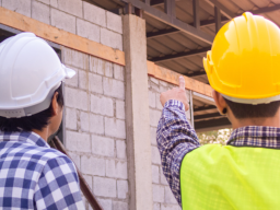 Construction Education people in hard hats from behind