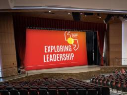 Aims Welcome Center Miller Auditorum with Exploring Leadership on the Screen