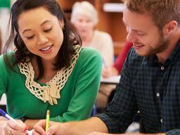 An Aims GED student getting help from an instructor.