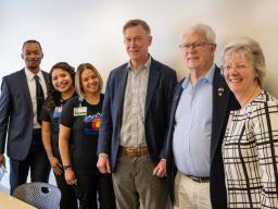 Sen. John Hickenlooper with Aims leadership and students