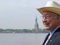 Ken Salazar with Statue of Liberty in the background