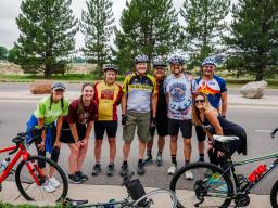 people standing in front of bikes