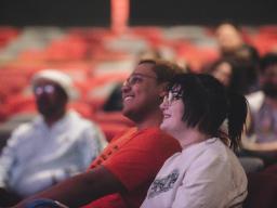 People watching performance at Aims