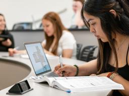 Aims students studying in classroom