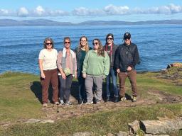 Group of people stading at an ocean side