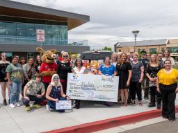 Arty's Pantry Large Check with Group of Employees and Students